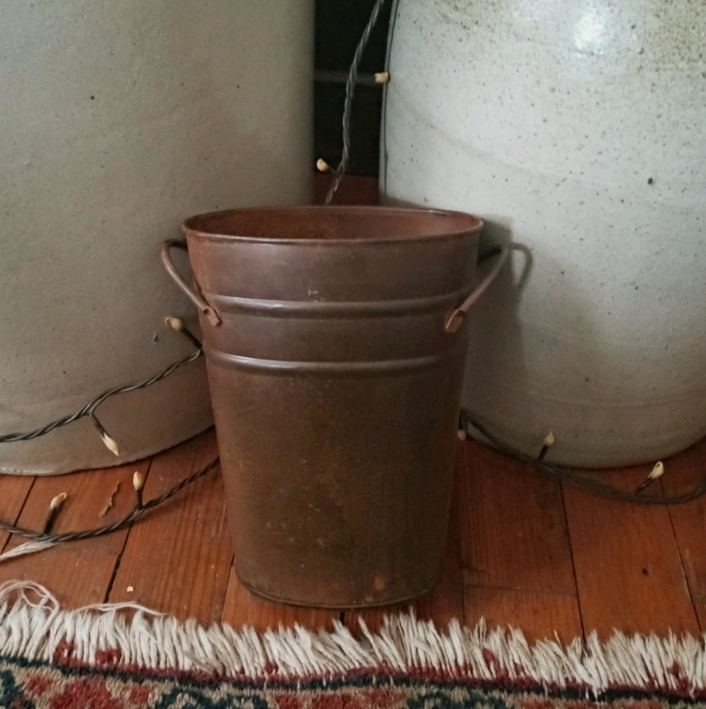 Rusty tin vase